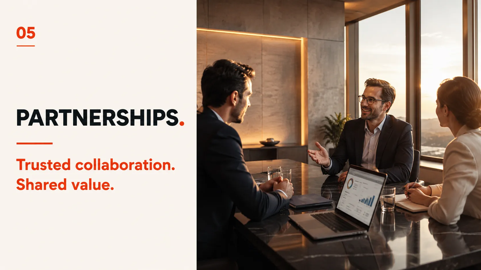 05 Partnerships. Trusted collaboration. Shared value. — a working conversation between partners in a boardroom, performance data open between them.